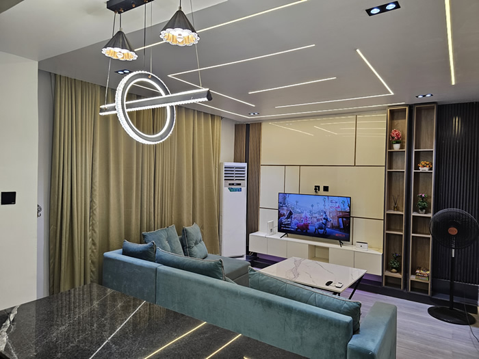 Meka Homes - cozy living room Abuja short let
